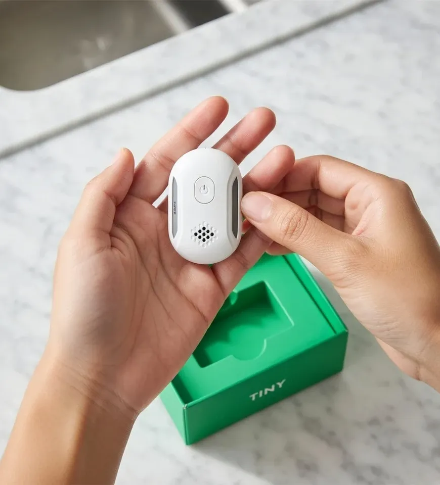 Homeowner unboxing the Vermix Pulse Pro pest repeller kit